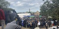 Two hundred documented refugees forced to join thousands camped at community hall