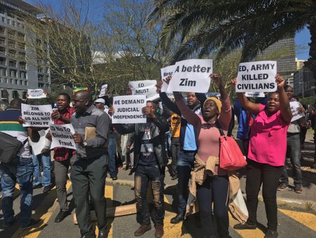 Mnangagwa’s critics and supporters face off in Cape Town