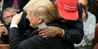 WASHINGTON, DC - OCTOBER 11:  (AFP OUT) (EDITORS NOTE: Retransmission with alternate crop.) U.S. President Donald Trump hugs rapper Kanye West during a meeting in the Oval office of the White House on October 11, 2018 in Washington, DC. (Photo by Oliver Contreras - Pool/Getty Images)