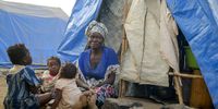 A woman and children in one of the shelter camps in Metuge, a space housing displaced people fleeing armed violence in northern Mozambique, Cabo Delgado, Mozambique, 16 August 2021 (issued 17 August 2021). Following the attacks, which have terrorized Cabo Delgado province since 2017, there are more than 3,100 deaths, according to the ACLED conflict registration project, and more than 817,000 displaced people, according to Mozambican authorities. (Photo: EPA-EFE / LUISA NHANTUMBO)