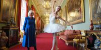 Britain's Queen Camilla, Patron of the English National Ballet, stands beside ballerina Sangeun Lee during a reception with staff, dancers, and supporters to celebrate the company's 75th anniversary and recognise the heritage, innovative creation of new works, and their learning and engagement programme, at Buckingham Palace on November 12, 2025 in London, England. (Photo: Yui Mok-Pool/Getty Images)