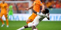 AL KHOR, QATAR - NOVEMBER 29: Daley Blind of Netherlands is challenged by Musaab Khidir of Qatar during the FIFA World Cup Qatar 2022 Group A match between Netherlands and Qatar at Al Bayt Stadium on November 29, 2022 in Al Khor, Qatar. (Photo by Matthias Hangst/Getty Images)