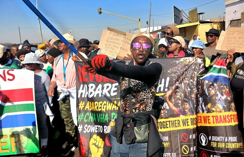 Anti-migrant marchers turn vigilante ‘labour inspectors’ — assaulting those branded foreign