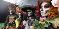 People dressed as catrinas participate in the first day of activities ahead of the Formula One Mexico Grand Prix at the Hermanos Rodriguez Racetrack in Mexico City, Mexico, 24 October 2024. The Formula One Mexico Grand Prix takes place on 27 October.  EPA-EFE/Mario Guzman