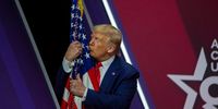 NATIONAL HARBOR, MARYLAND - FEBRUARY 29: President Donald Trump kisses the flag of the United States of America at the annual Conservative Political Action Conference (CPAC) at Gaylord National Resort &amp; Convention Center February 29, 2020 in National Harbor, Maryland. Conservatives gather at the annual event to discuss their agenda.  (Photo by Tasos Katopodis/Getty Images)