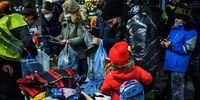 BERLIN, GERMANY - MARCH 06: People fleeing war-torn Ukraine look for clothing after arriving on a train from Poland at the Hauptbahnhof main railway station on March 6, 2022 in Berlin, Germany. Over one million people, mainly Ukrainian women and children as well as foreigners living or working in Ukraine, have fled Ukraine as the current Russian military invasion continues to inflict growing casualties on the civilian population. (Photo by Carsten Koall/Getty Images)