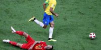 Eden Hazard (down) of Belgium reacts after a tackle during the FIFA World Cup 2018 quarter final soccer match between Brazil and Belgium in Kazan, Russia, 06 July 2018.  EPA-EFE/TATYANA ZENKOVICH
