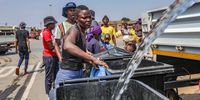 Residents get water from a government truck at Tsakane informal settlement in Gauteng on 21 October 2022. (Photo: Gallo Images / OJ Koloti)