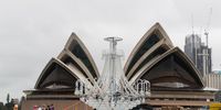 SYDNEY, AUSTRALIA - MARCH 06: A giant chandelier os transported across Sydney Harbour with some of the cast of La Traviata on March 06, 2020 in Sydney, Australia. The 9m high crystal chandelier weighs 3.5 tonnes and is part of the set for Handa Opera's upcoming production of La Traviata. (Photo by Brook Mitchell/Getty Images)