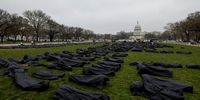 WASHINGTON, DC - MARCH 24: Body bags are assembled on the National Mall by gun control activist group March For Our Lives on March 24, 2022 in Washington, DC. The group arranged 1,100 body bags to spell out the words “thoughts and prayers,” to mark the four-year anniversary of the student-led demonstration in the streets of Washington after the Parkland school shooting. (Photo by Anna Moneymaker/Getty Images)