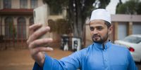 Safik Lulat takes a selfie outside his house on Eid morning in Lenasia. (Photo: Daily Maverick / Shiraaz Mohamed)