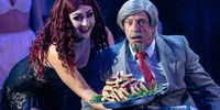 Magenta (Jasmine Minter) serves up some (possibly edible?) delights to Dr Everett Scott (Zak Hendrikz) in the Rocky Horror Show