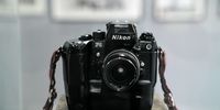 A Nikon F4 camera belonging to Wulfsohn stands on display as part of the exhibition. Johannesburg, 9 November 2022.<br>Photo: Shiraaz Mohamed.
