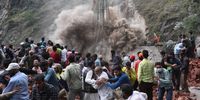 epaselect epa09960439 Onlookers run to safety as landslide hits near ongoing rescue operation site in Ramban district, south of Srinagar, the summer capital of Indian Kashmir, 20 May 2022. According to the government official in disaster management department, 10 workers were trapped after part of a tunnel collapsed.  EPA-EFE/FAROOQ KHAN