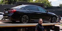 Carnilinx director Adriano Mazzotti's BMW 7 Series was towed from his luxury Hyde Park estate after SARS obtained a High Court warrant of execution on Monday, 18 February, to attach his movable property to the value of R33 955 228,22. It was one of three cars attached by SARS on Monday. Photo: Greg Nicolson
