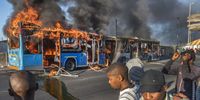 A MyCiti bus burns in Khayelitsha  during the taxi industry stay away on 21 November, 2022 in Cape Town, South Africa. It is reported that law enforcement have been deployed to respond to the threatened public transport shutdown and taxi strike. (Photo by Gallo Images/Brenton Geach)