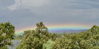  have seen many rainbows in my life from an absolutely beautiful, crystal clear, full circle one (Many years ago I was on the top/side of a koppie w/o a camera unfortunately) to this the flattest I have ever seen. <br>Taken on Monday afternoon (16.00) over Buffelspoort Dam looking East. 
