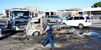 Police investigate the scene of seven vehicles that are allegedly to have been burnt by Nyanga taxi drivers on Wednesday morning. Photo: Xabiso Mkhabela