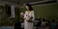 A Ukrainian mother tends to her newborn in a basement maternity ward as Russian forces fight Ukrainian forces on the outskirts of Kyiv, Ukraine. March 2022. (Photograph: Courtesy of Lynsey Addario and Lyles & King, New York)