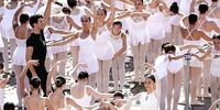Italian dancer Roberto Bolle leads the world's largest ballet barre class in Turin