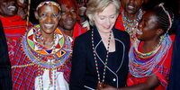 Then US Secretary of State, Hillary Rodham Clinton is presented with beads by traditional dancers at Carnivore restaurant in Nairobi, Kenya, 5 August 2009. The RRT, with the help of the CIA, thwarted a terror plot against her on this visit. (Photo: EPA/STR)<br>