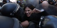 Members of the Bolivian Police block protesters to access the courthouse where the trial against the former interim president of Bolivia, Jeanine Anez (2019-2020), takes place in La Paz, Bolivia, 17 October 2024. The trial against Jeanine Anez and the suspended governor of the eastern region of Santa Cruz, Luis Fernando Camacho, for their roles in the political crisis of 2019 began with the review of incidents presented by the defense of both.  EPA-EFE/LUIS GANDARILLAS