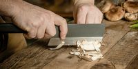 Chef’s Table head chef Mathew Armbruster cuts mushrooms with a sebsteelworks nakiri, perfect for chopping veggies. (Photo: Sebastian Nico)<br>