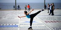 A young girl practices her skating skills in the Spring sunshine on Blackpool promenade as parts of the UK are set to see the warmest day of the year so far on March 30, 2021 in Blackpool, United Kingdom.  Forecasters are predicting temperatures of 22C (72F) and with the easing of pandemic lockdown rules many people will be heading for the outdoors. (Photo by Christopher Furlong/Getty Images)