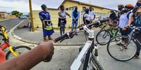 Deborah Odumuko from the Ekuphumleni Community Action Network welcomes cyclists and shares her experience running a community kitchen with family and neighbours. (Photo: Shaun Doch)
