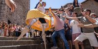 Residents wearing traditional costumes and walking on stilts take part in a 'colorful dance' along a slope as part of a festival called 'The Anguiano Dancers' in Anguiano, La Rioja, northern Spain, 22 July 2025. The dancers walk down a slope, turning like a human spinning top onto 45-centimeter-high stilts to worship the town's patron, Mary Magdalene, in a tradition dating back to 1603.  EPA/RAQUEL MANZANARES