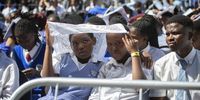 Schoolchildren shield themselves from the sun outside Cape Town City Hall on 11 February 2020 while listening to President Cyril Ramaphosa deliver a speech to commemorate the 30th anniversary of the release of Nelson Mandela in 1990. (Photo: Leila Dougan)