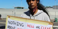 Gabriel Klaasen, communications officer and advocate at Project 90 by 2030, at the protest outside the National Nuclear Regulator office in Table View, Cape Town, on 17 February 2022. Protesters demanded transparency regarding the suspension of civil society NNR board representative Peter Becker. (Photo: Tamsin Metelerkamp)