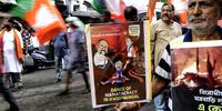 Bharatiya Janata Party (BJP) activists carry placards and flags as they march during a protest against the Bengal government in Kolkata, India, 19 July 2023. Bengal's opposition party BJP demands to stop the violence against the people of Bengal, and justice for their party members, who were amongst the victims killed in a wave of violence that marked Panchayat polls across West Bengal.  (Photo: EPA-EFE / PIYAL ADHIKARY)