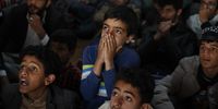 epa10320541 Yemeni soccer fans react as they watch a live broadcast of the FIFA World Cup Qatar 2022 group C soccer match between Argentina and Saudi Arabia, inside a paid-entry shop in Sana'a, Yemen, 22 November 2022.  EPA-EFE/YAHYA ARHAB