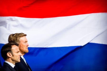 Protester detained during French president's visit to the Netherlands, and more from around the world