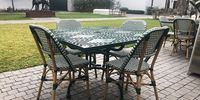 A touch of France, outside, in these French bistro chairs. Photo: Tony Jackman