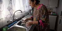 Zerina Suliman as she pours a glass of water in her kitchen Suliman says the water crisis has an adverse effect of her daily prayers as she needs water to perform ablution. 7 September 2022. Lenasia South, Johannesburg. (Photo: Shiraaz Mohamed)