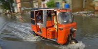 A tricycle makes its way through a flooded road following heavy monsoon rains in Karachi, Pakistan, 25 July 2023. At least 13 people have been killed, with nine deaths in Khyber Pakhtunkhwa province and four in a landslide in the Skardu area following monsoon rains. With 74 houses damaged and flash floods prompting an emergency declaration in the Chitral district, the death toll since the start of the monsoon season has reached 101 according to provincial and national disaster management authorities. The Pakistan Meteorological Department (PMD) has issued a cautionary advisory to residents in the affected areas.  EPA-EFE/SHAHZAIB AKBER