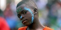 A boy takes part in an anti-sanctions protest march in Harare. (Photo: EPA-EFE / Aaron Ufumeli)