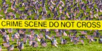 Crime scene tape flies in front of a 9/11 memorial following the fatal shooting of political activist Charlie Kirk during an event at Utah Valley University on September 11, 2025 in Orem, Utah. Authorities have released a "person of interest" as they search for the suspect who shot and killed Kirk, founder of Turning Point USA, while he was speaking at an event for his "American Comeback Tour". (Photo by Michael Ciaglo/Getty Images)