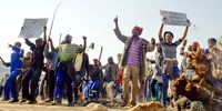 Residents during a protest over power outages on July, 2014 in Mamelodi, South Africa. More than 400 Mamelodi residents barricaded Tsamai Avenue with rocks and burning tyres, shouting that they were unhappy about the constant power outages. Power outages have resulted in several protests across Gauteng, including Mamelodi East, Tshwane and Thokoza in Ekurhuleni. (Photo: Gallo Images / Foto24 / Deaan Vivier)
