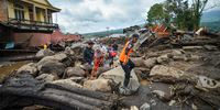 Locals walk in an area affected by heavy rain brought flash floods and landslides as they are evacuated in Agam, West Sumatra province, Indonesia, May 12, 2024, in this photo taken by Antara Foto. Antara Foto/Iggo El Fitra/via REUTERS ATTENTION EDITORS - THIS IMAGE HAS BEEN SUPPLIED BY A THIRD PARTY. MANDATORY CREDIT. INDONESIA OUT. NO COMMERCIAL OR EDITORIAL SALES IN INDONESIA.