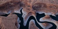 The tall bleached "bathtub ring" is visible on the rocky banks of Lake Powell at Reflection Canyon on June 24, 2021 in Lake Powell, Utah. As severe drought grips parts of the Western United States, a below average flow of water is expected to flow through the Colorado River Basin into two of its biggest reservoirs, Lake Powell and Lake Mead. Lake Powell is currently at 34.56 percent of capacity, a historic low. The lake stands at 138.91 feet below full pool and has dropped 44 feet in the past year. The Colorado River Basin supplies water to 40 million people in seven western states. (Photo by Justin Sullivan/Getty Images)