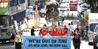 Extinction Rebellion protesters push a giant animatronic puppet depicting a burning Koala called 'Blinky' through the streets of the central business district (CBD) in Brisbane, Queensland, Australia, 15 March 2023. Extinction Rebellion (XR) environmental activists marched through the CBD of Brisbane to protest against the fossil fuel industry.  EPA-EFE/DARREN ENGLAND 