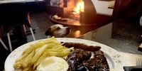 Mixed grill and a dog called Jakkals. (Photo: Tony Jackman)