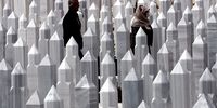Bosnian Muslims pray while standing between the gravestones at the Vlakovo cemetary in Sarajevo, Bosnia and Herzegovina, 22 April 2023. On occasion of the Muslim holiday of Eid al-Fitr, which is marking the end of the holy fasting month of Ramadan, many Bosnian Muslims visited cemeteries to offer prayers for the dead.  EPA-EFE/FEHIM DEMIR