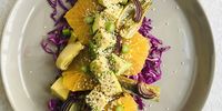 Roast fennel salad with red cabbage slaw, avocado, and orange syrup dressing. Photo supplied