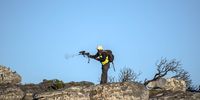 A Human Wildlife Services (HWS) ranger fires his paintball gun at members of the Slangkop baboon troop to keep them contained on Slangkop Mountain above Kommetjie in the deep south of Cape Town. (Photo: Alan van Gysen)