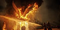 Firefighters make sure fire doesn't get out of control while a papier-mache sculpture or 'falla' burns during the 'Nit de la Crema' (Fire Night) of the Fallas Festival in Valencia, eastern Spain, 19 March 2024 (issued 20 March 2024). Fallas is a fortnight-long fiesta in which installations of parodic papier-mache, cardboard, and wooden sculptures are traditionally burnt every year on the last day of the event in the so-called 'Crema' to end the festivities.  EPA-EFE/Biel Alino