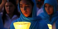 Believers walk in procession with Apupu (bitter orange) lamps to illuminate the 'yvaga rape' ('path to heaven' in the Guarani language) on Good Friday, in Tanarandy, Paraguay, 07 April 2023.  EPA-EFE/Fernando Franceschelli